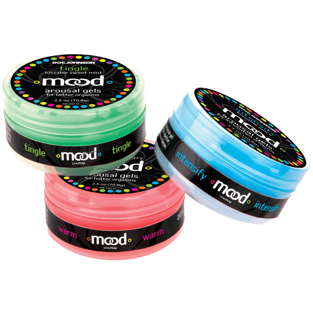 Three round containers that look like they contain coloured gels. One is bright green, one is vibrant red and the other is sky blue.