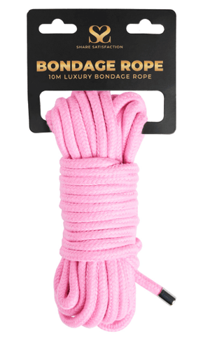 Open image in slideshow, Pink bondage rope on a white background with packaging labeled &#39;Bondage Rope&#39;.
