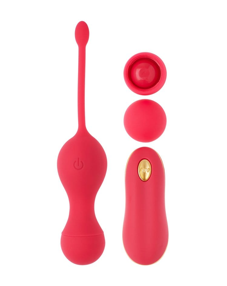 Four red rubber objects lay on a white background, two are round balls while one is an oval shape and the last is a tear drop shape with a long skinny tail.